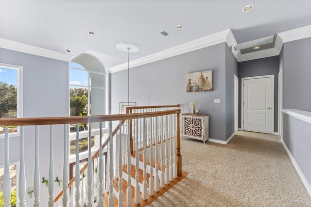 corridor featuring light carpet and crown molding