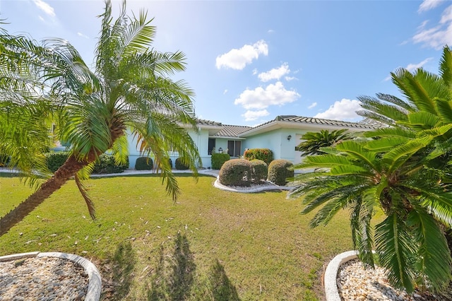 view of front of property with a front lawn