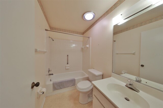 full bathroom featuring vanity, tiled shower / bath combo, and toilet