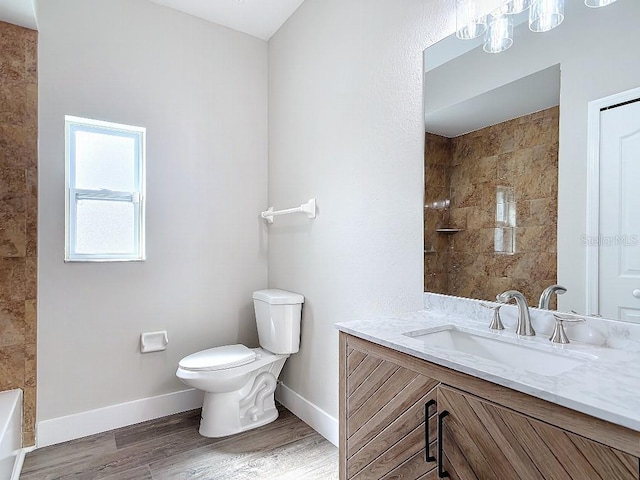 full bathroom featuring vanity, hardwood / wood-style floors, separate shower and tub, and toilet