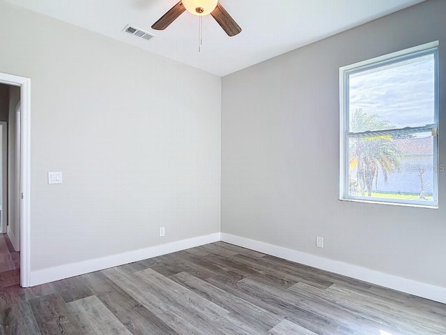 unfurnished room featuring hardwood / wood-style flooring and ceiling fan