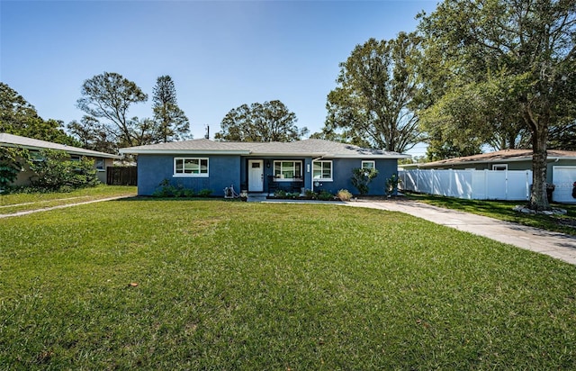 ranch-style home with a front lawn