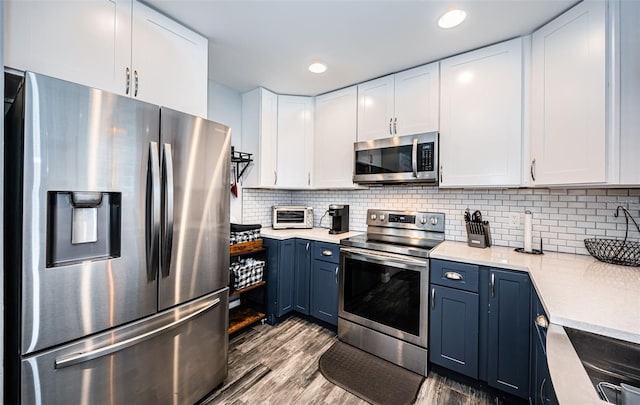 kitchen featuring white cabinetry and stainless steel appliances