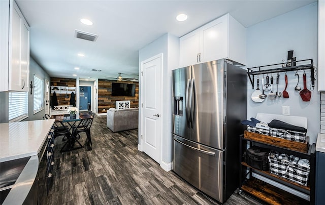 kitchen with stainless steel refrigerator with ice dispenser, white cabinets, ceiling fan, and dark hardwood / wood-style floors