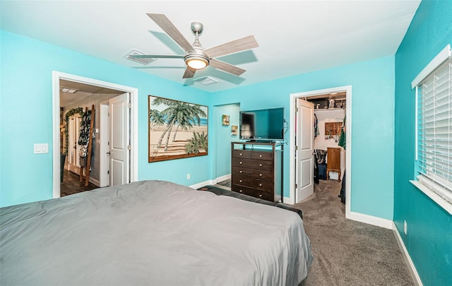 bedroom featuring ceiling fan and dark carpet