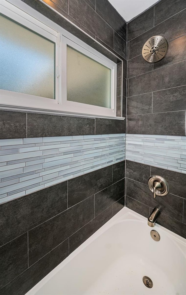 bathroom featuring separate shower and tub