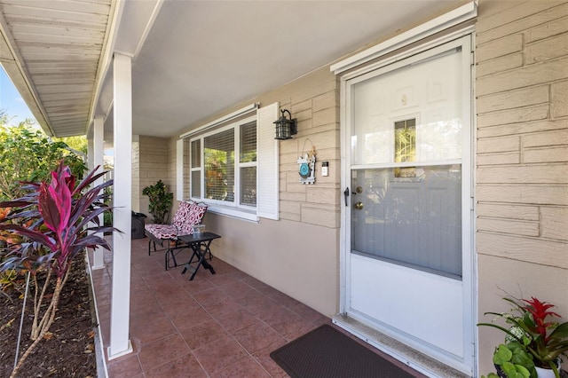 doorway to property featuring a porch