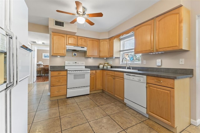 kitchen featuring sink, light tile patterned flooring, white appliances, and ceiling fan