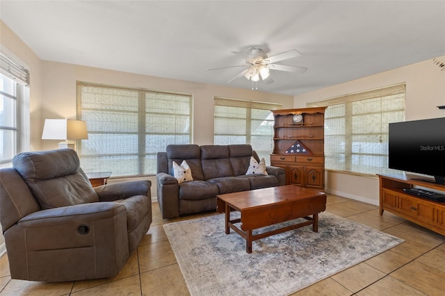 tiled living room with ceiling fan