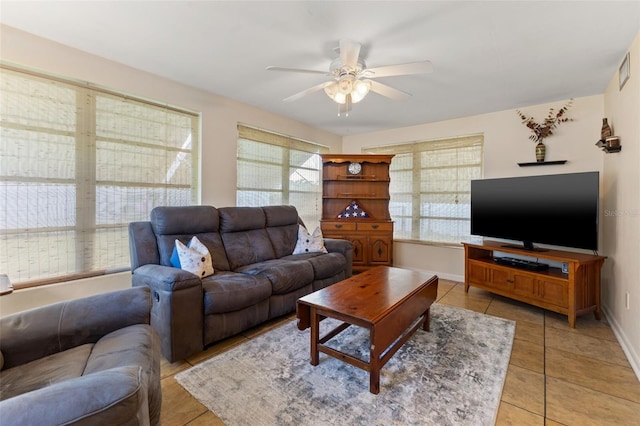 tiled living room featuring ceiling fan