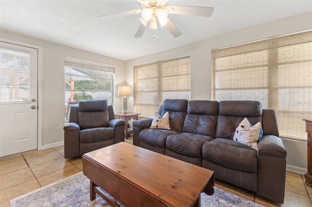 living room featuring light tile patterned flooring and ceiling fan