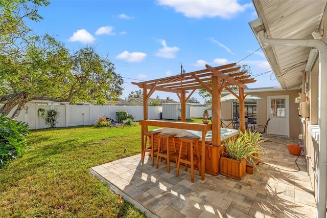 view of patio / terrace with a bar and a pergola