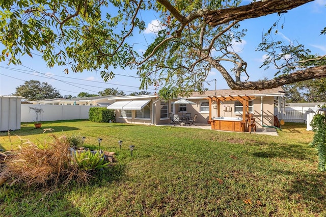 view of yard with a patio and a hot tub