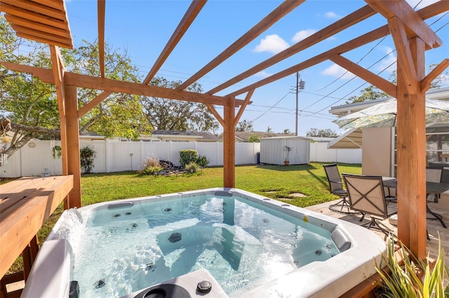 view of swimming pool with a hot tub, a shed, and a lawn