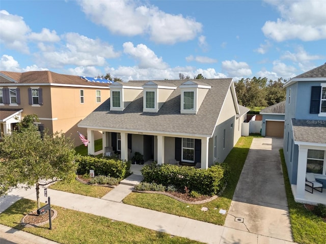 view of front of home featuring a porch and a garage