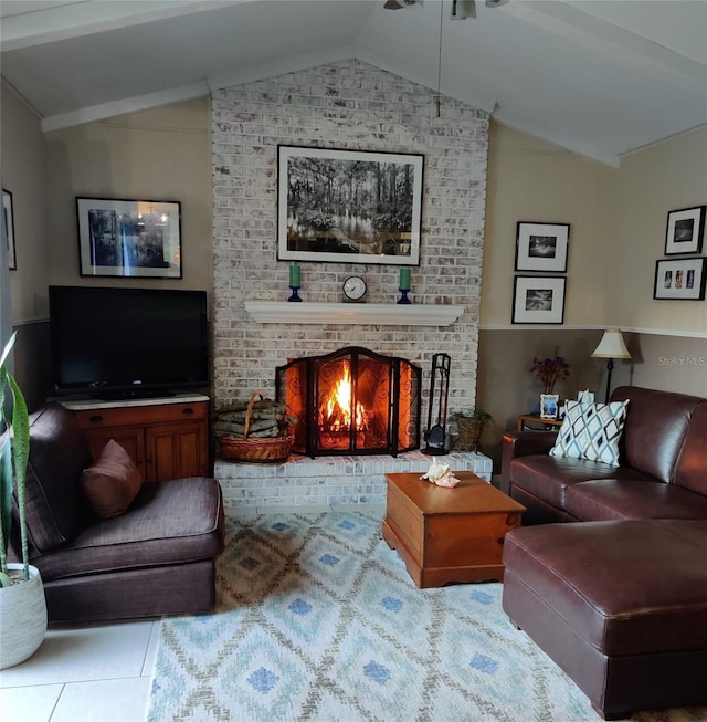 tiled living room featuring a fireplace and vaulted ceiling