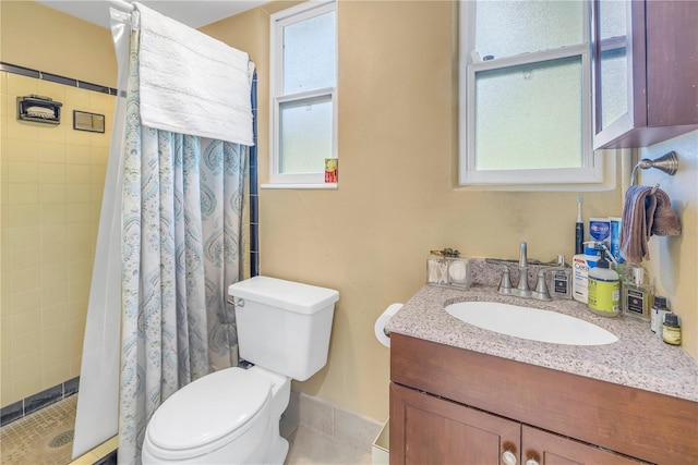 bathroom with toilet, a shower with shower curtain, and vanity