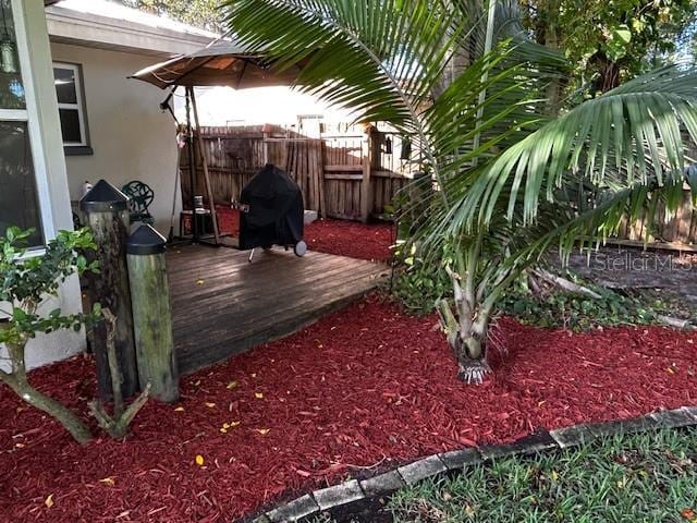 view of yard featuring a wooden deck