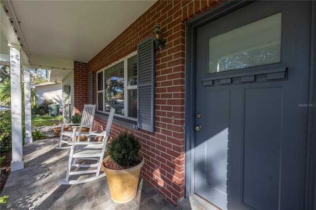 doorway to property featuring a porch