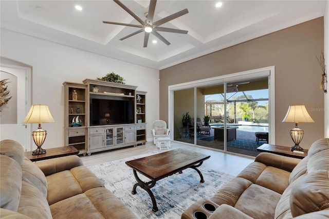 living room featuring coffered ceiling, ornamental molding, ceiling fan, beam ceiling, and light hardwood / wood-style floors