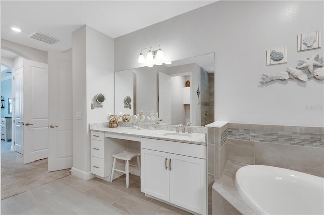 bathroom with vanity, tile patterned floors, and independent shower and bath