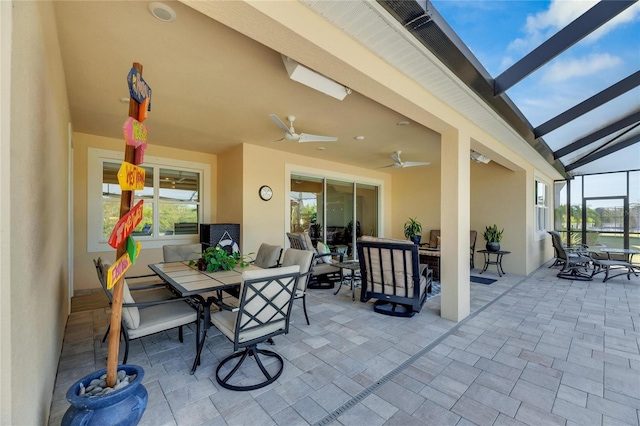 view of patio / terrace with a lanai and ceiling fan