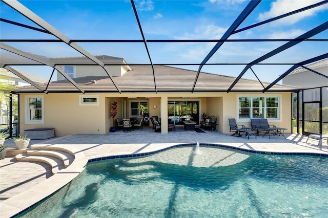 view of swimming pool with a patio, an outdoor hangout area, and glass enclosure