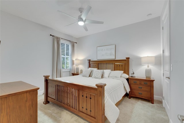 bedroom with ceiling fan and light carpet