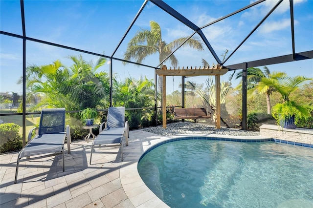 view of pool featuring a pergola, a patio area, and glass enclosure