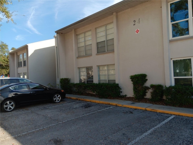 2625 State Road 590 Unit 2412, Clearwater, FL 33759 - view of building exterior featuring uncovered parking