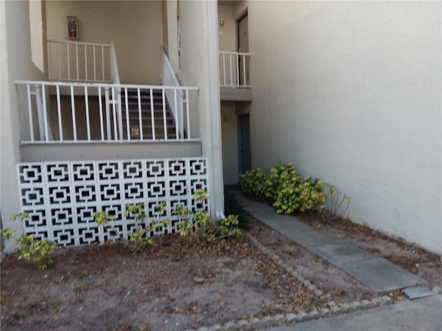 2625 State Road 590 Unit 2412, Clearwater, FL 33759 - doorway to property with stucco siding