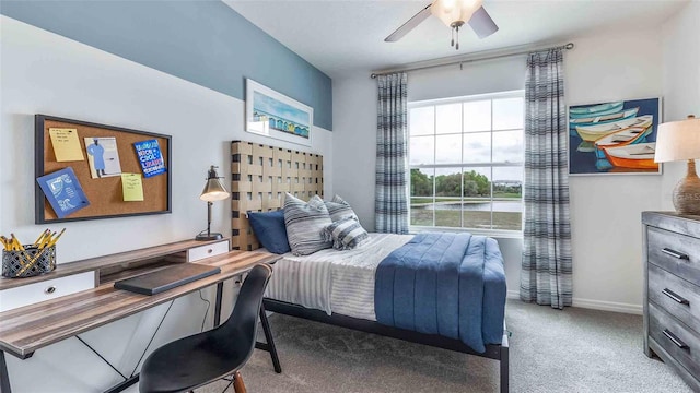 bedroom featuring ceiling fan and light carpet