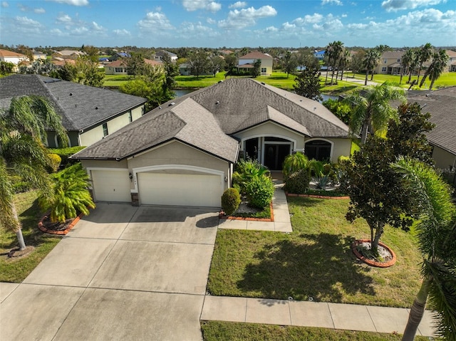 view of front facade with a front lawn and a garage