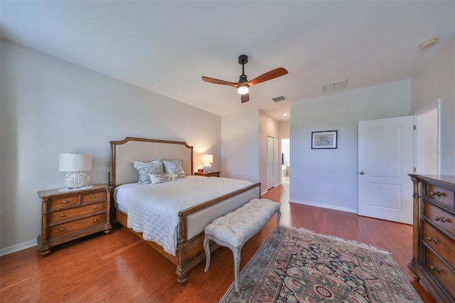 bedroom featuring hardwood / wood-style flooring and ceiling fan