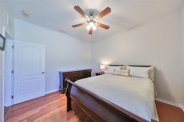 bedroom featuring wood-type flooring and ceiling fan