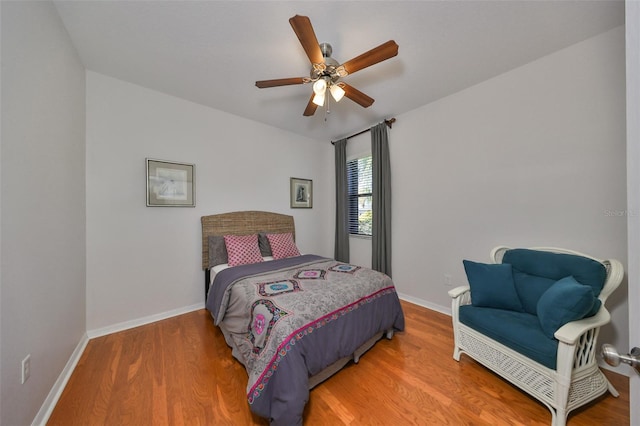 bedroom featuring ceiling fan and hardwood / wood-style floors