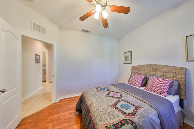 bedroom featuring ceiling fan and light hardwood / wood-style flooring