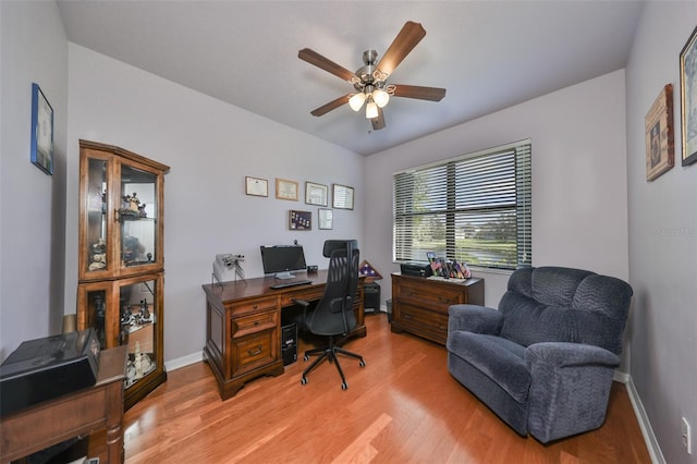 office featuring wood-type flooring and ceiling fan