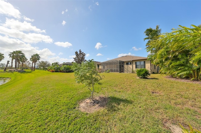 view of yard with a lanai