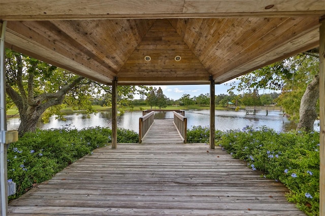 view of dock featuring a gazebo and a water view