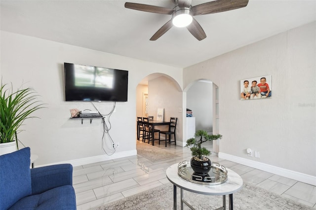 living room with ceiling fan