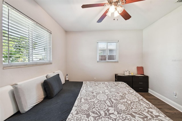 bedroom featuring dark wood-type flooring and ceiling fan