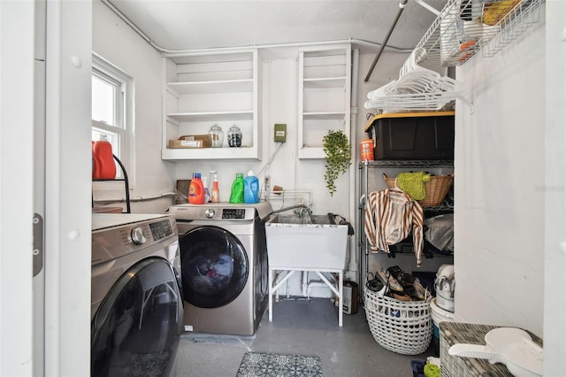 washroom with sink and washing machine and clothes dryer