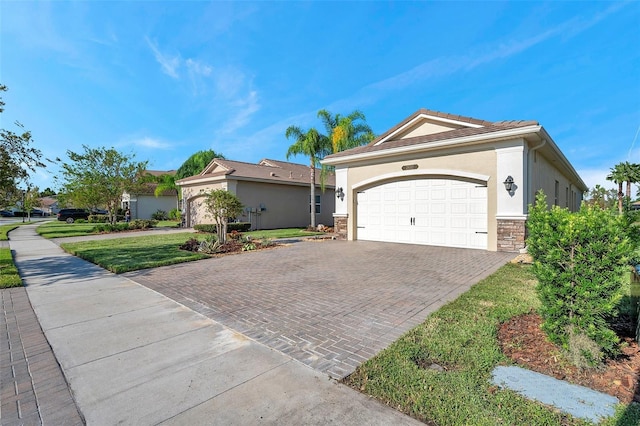 ranch-style house with a front lawn and a garage