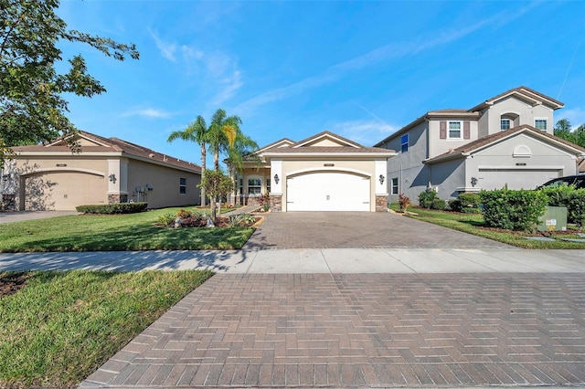 view of front of home featuring a front yard and a garage