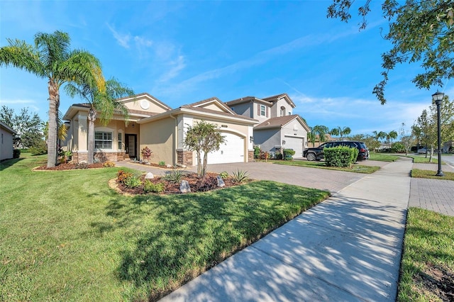 view of front facade with a front lawn and a garage