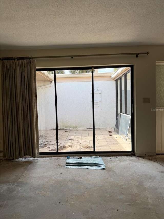 interior space featuring a textured ceiling