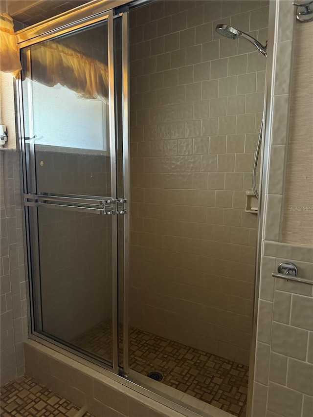 bathroom featuring an enclosed shower