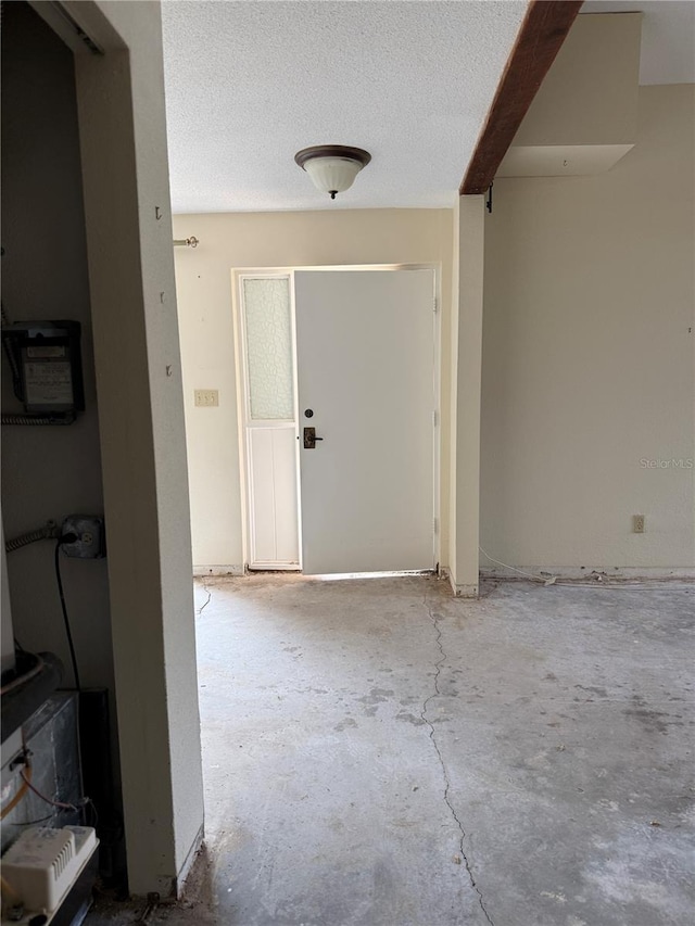 hallway featuring a textured ceiling