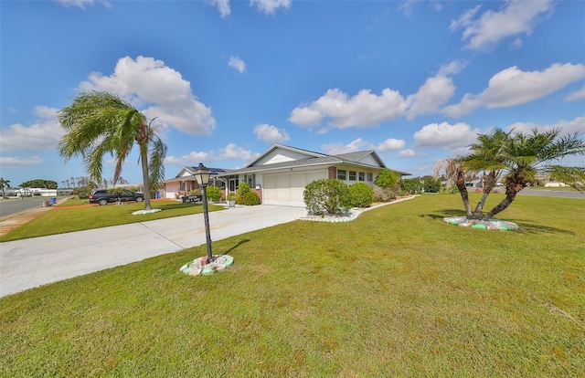 ranch-style home with a garage and a front lawn